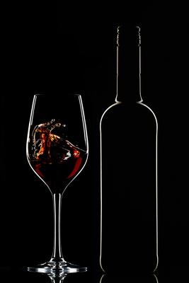 Red wine bottle and filled glass-stock-photo
