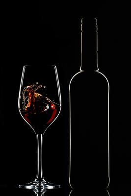 Red wine bottle and filled glass-stock-foto