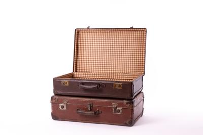 vintage brown suitcases on white background-stock-photo