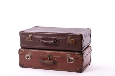 vintage brown suitcases on white background-stock-photo