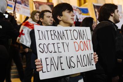  Demonstration of the Georgian opposition - 04/11/2024 - Georgia (Europe) / Tbilisi / Tbilisi - A young man with a sign-stock-photo