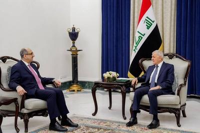 Iraqi President Abdul Latif Jamal Rashid receives Syrian Minister of Foreign Affairs and Expatriates Bassam Sabbagh-stock-photo