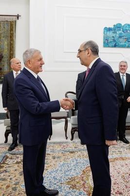 Iraqi President Abdul Latif Jamal Rashid receives Syrian Minister of Foreign Affairs and Expatriates Bassam Sabbagh-stock-photo