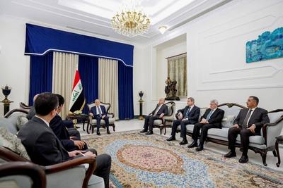 Iraqi President Abdul Latif Jamal Rashid receives Syrian Minister of Foreign Affairs and Expatriates Bassam Sabbagh-stock-photo