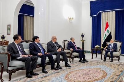 Iraqi President Abdul Latif Jamal Rashid receives Syrian Minister of Foreign Affairs and Expatriates Bassam Sabbagh-stock-photo