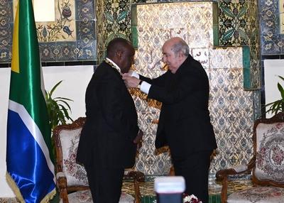 Algerian President Abdelmadjid Tebboune honors South African President Cyril Ramaphosa, and awards him the Athir Medal,-stock-photo