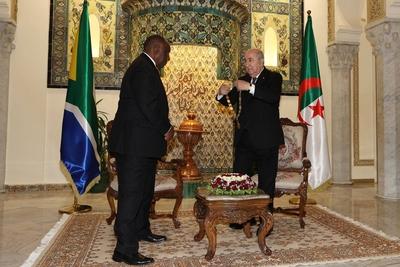 Algerian President Abdelmadjid Tebboune honors South African President Cyril Ramaphosa, and awards him the Athir Medal,-stock-photo