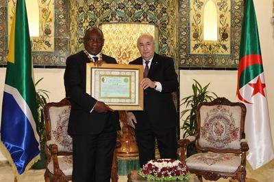 Algerian President Abdelmadjid Tebboune honors South African President Cyril Ramaphosa, and awards him the Athir Medal,-stock-photo