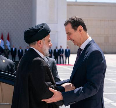 Syrian President Bashar al-Assad receives the Iranian President Ebrahim Raisi at the presidential palace-stock-photo