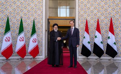 Syrian President Bashar al-Assad receives the Iranian President Ebrahim Raisi at the presidential palace-stock-photo