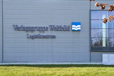Augsburg, Bavaria, Germany - October 29, 2024: Logo of the insolvent Weltbild publishing group at the logistics center i-stock-foto