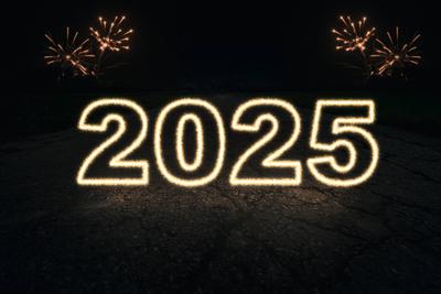 Bavaria, Germany - December 8, 2024: Glowing number 2025 in the dark, accompanied by fireworks. Symbolic image for the s-stock-foto