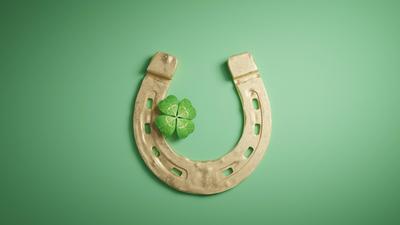 Horseshoe and lucky clover with copy space. 3d illustration Horseshoe and concept of luck. St. Patricks Day card. 3d ill-stock-photo
