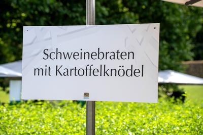 Munich, Bavaria, Germany - July 11, 2024: Sign at a catering establishment with the inscription: Roast pork with potato-stock-photo