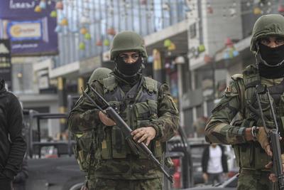Palestinian security forces gather at the site of a protest against clashes between Palestinian security forces and militants in the northern occupied West Bank city of Jenin-stock-photo