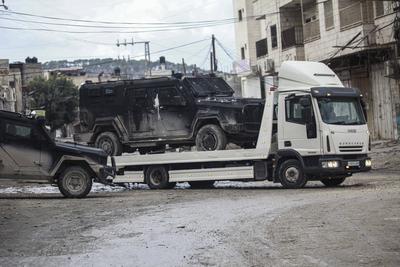 Palestinian security forces gather at the site of a protest against clashes between Palestinian security forces and militants in the northern occupied West Bank city of Jenin-stock-photo