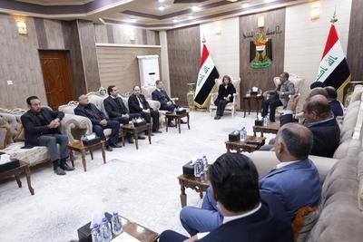 The wife of the Iraqi President, Shahnaz Ibrahim Ahmed, attends the opening ceremony of a new cemetery-stock-foto