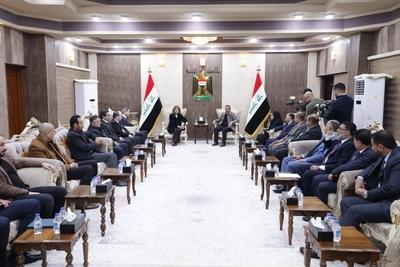 The wife of the Iraqi President, Shahnaz Ibrahim Ahmed, attends the opening ceremony of a new cemetery-stock-foto