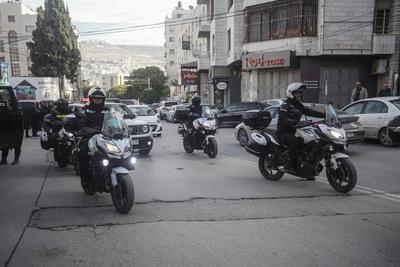 Palestinian National Security personnel mourn the body of Palestinian National Security officer Saher Arheel, who was killed during clashes in the Jenin refugee camp-stock-photo
