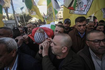 Palestinian National Security personnel mourn the body of Palestinian National Security officer Saher Arheel, who was killed during clashes in the Jenin refugee camp-stock-photo