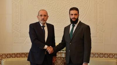 Commander-in-Chief of the New Syrian Administration, Ahmad al-Shara', meets with Jordanian Minister of Foreign Affairs-stock-photo
