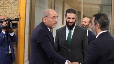Commander-in-Chief of the New Syrian Administration, Ahmad al-Shara', meets with Jordanian Minister of Foreign Affairs-stock-photo