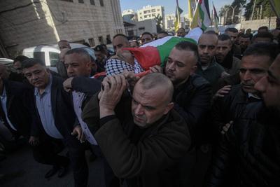 Palestinian National Security personnel mourn the body of Palestinian National Security officer Saher Arheel, who was killed during clashes in the Jenin refugee camp-stock-photo