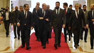 Commander-in-Chief of the New Syrian Administration, Ahmad al-Shara', meets with Jordanian Minister of Foreign Affairs-stock-photo