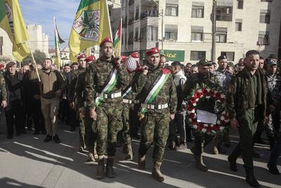 Palestinian National Security personnel mourn the body of Palestinian National Security officer Saher Arheel, who was killed during clashes in the Jenin refugee camp-stock-photo