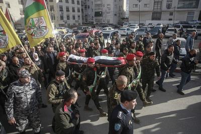 Palestinian National Security personnel mourn the body of Palestinian National Security officer Saher Arheel, who was killed during clashes in the Jenin refugee camp-stock-photo