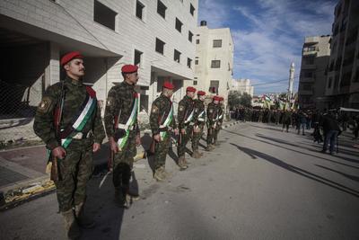 Palestinian National Security personnel mourn the body of Palestinian National Security officer Saher Arheel, who was killed during clashes in the Jenin refugee camp-stock-photo