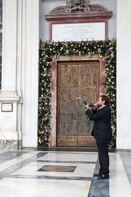 ITALY -  CARDINAL JAMES MICHAEL HARVEY OPENS THE HOLY DOOR OF THE BAILICA OF SAINT PAUL OUTSIDE THE WALLS , FOR THE JUBILEE, IN ROME  - 2025/1/5-stock-photo