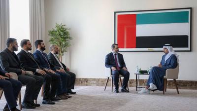 Syrian Foreign Minister Asaad Al-Sheibani, Defense Minister Major General Marhaf Abu Qasra, and General Intelligence Chief Anas Khattab meet with Sheikh Abdullah bin Zayed Al Nahyan-stock-photo