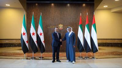 Syrian Foreign Minister Asaad Al-Sheibani, Defense Minister Major General Marhaf Abu Qasra, and General Intelligence Chief Anas Khattab meet with Sheikh Abdullah bin Zayed Al Nahyan-stock-photo