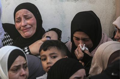 Palestinians carry the body of Moataz al-Madani, 16, who was killed during clashes with Israeli occupation forces, in Askar camp east of the West Bank city of Nablus-stock-photo
