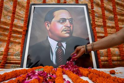 NOIDA, INDIA - APRIL 14: People offer floral tributes on the occasion of the 133th birth anniversary of Dalit icon BR Am-stock-photo