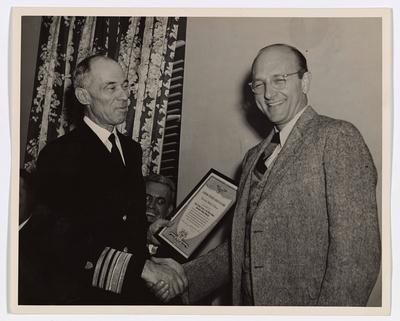 RECORD DATE NOT STATED Vice Admiral R. R. Waesche Presenting the Security Shield of Honor to Mr. David E. Lilienthal, Ch-stock-photo