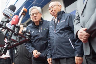 Jensen Huang, NVIDIA founder and CEO and C.W Tsai, SPIL chairman, answer questions after the opening ceremony of new Tai-stock-photo