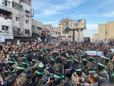 Palestinians gather near the site of the handover of the Israeli hostages to the International Committee of the Red Cross (ICRC)-stock-photo