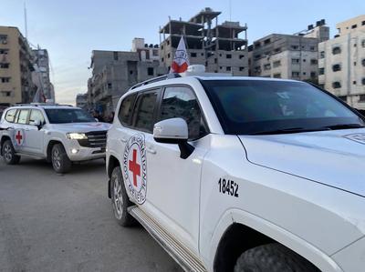 Palestinians gather near the site of the handover of the Israeli hostages to the International Committee of the Red Cross (ICRC)-stock-photo
