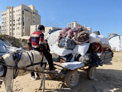 Displaced Palestinian families in Gaza City begin moving their tents and personal belongings back to their homes-stock-photo