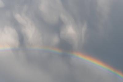 Rainbow appearing in rainy clouds in spring. Rainbow appearing in rainy clouds in spring. Bas Rhin, Alsace, France, Euro-stock-photo
