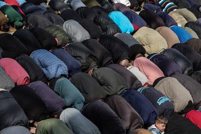 Palestinians perform Friday prayers at the Al-Bureij Services Club stadium, which was destroyed by Israeli airstrikes on the Al-Burei-stock-photo
