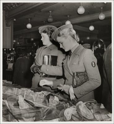 German female soldiers in front German female soldiers in front of a display of scarves, Printemps department store, Par-stock-photo