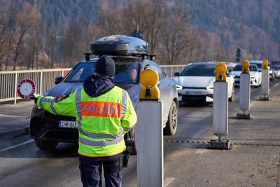 Oberaudorf, Bavaria, Germany - February 6, 2025: Symbolic image border control or traffic control. Policewoman stops tra-stock-foto
