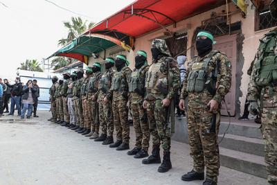 Members of the al-Qassam Brigades of Hamas attend the funeral ceremony of Merwan Isa a commander of the al-Qassam Brigades, who was killed during an Israeli attack, at Bureij refugee camp in central of Gaza Strip-stock-photo