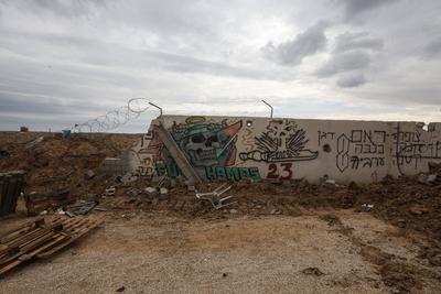 Palestinians inspect the destruction after the Israeli army withdrew from the Netzarim corridor, as part of a ceasefire agreement with Hamas in Gaza City-stock-photo