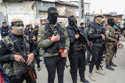 Members of the al-Qassam Brigades of Hamas attend the funeral ceremony of Merwan Isa a commander of the al-Qassam Brigades, who was killed during an Israeli attack, at Bureij refugee camp in central of Gaza Strip-stock-photo