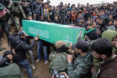 Members of the al-Qassam Brigades of Hamas attend the funeral ceremony of Merwan Isa a commander of the al-Qassam Brigades, who was killed during an Israeli attack, at Bureij refugee camp in central of Gaza Strip-stock-photo