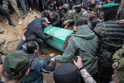 Members of the al-Qassam Brigades of Hamas attend the funeral ceremony of Merwan Isa a commander of the al-Qassam Brigades, who was killed during an Israeli attack, at Bureij refugee camp in central of Gaza Strip-stock-photo